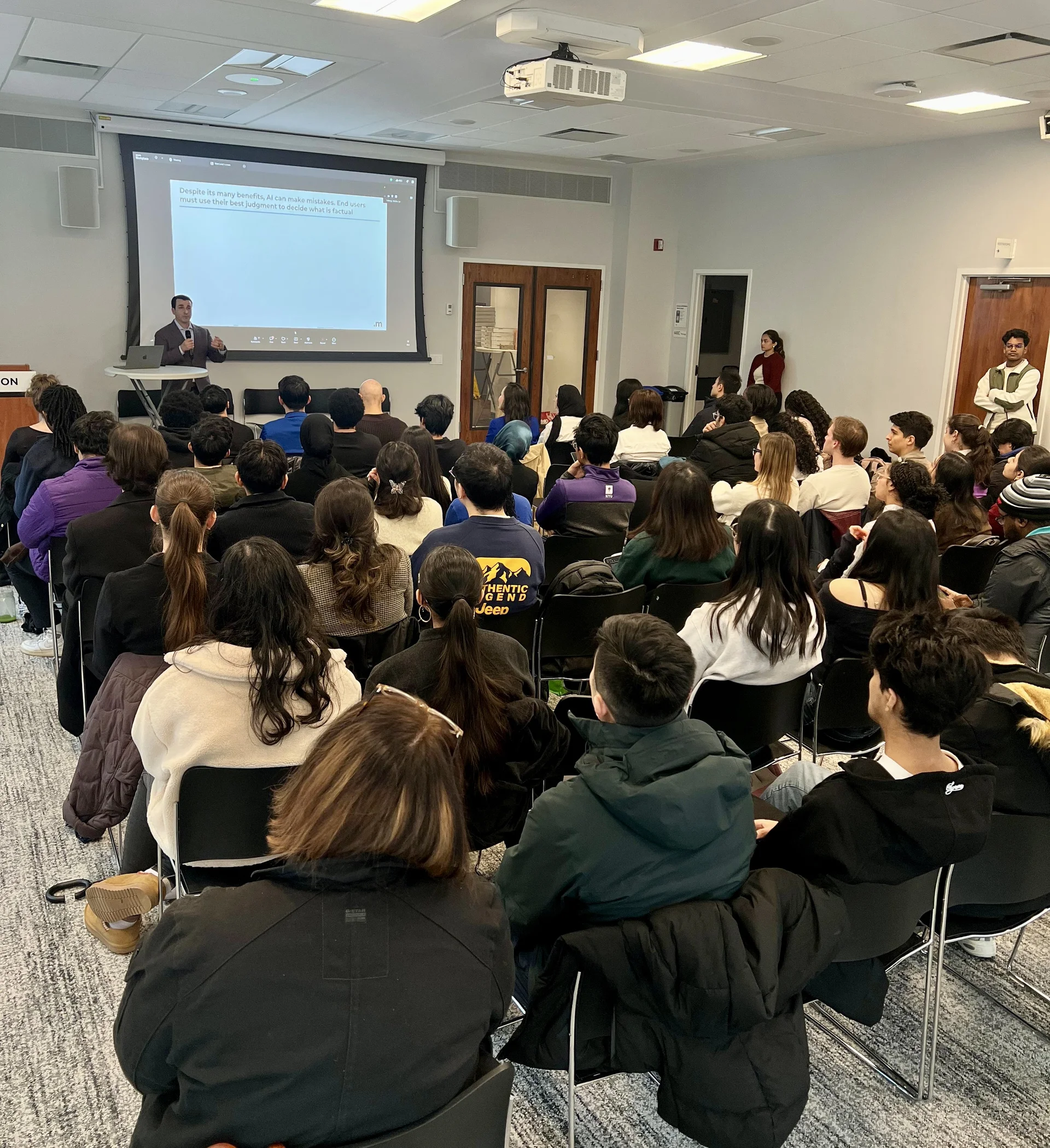 University lecture hall with students and speakers